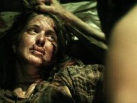 Blonde Girl Tied to a Bed With Barbed Wire